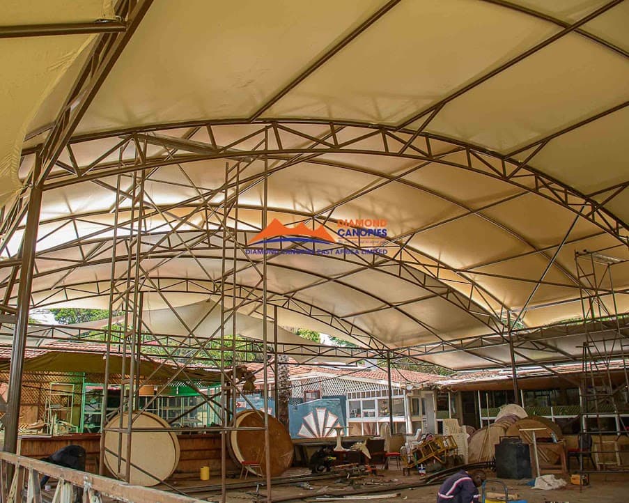 Tensile membrane canopy by Diamond Canopies covering a walkway in Kenya