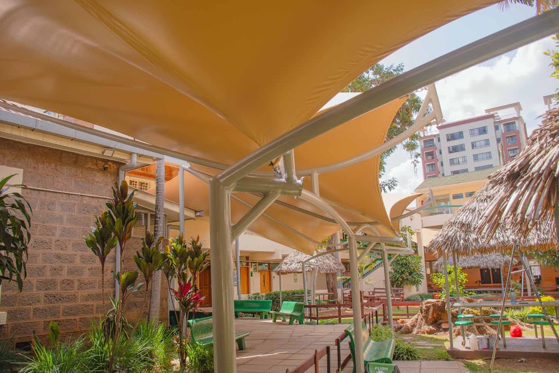 Barrel-vault walkway shade with curved roof at a hospital in Kenya